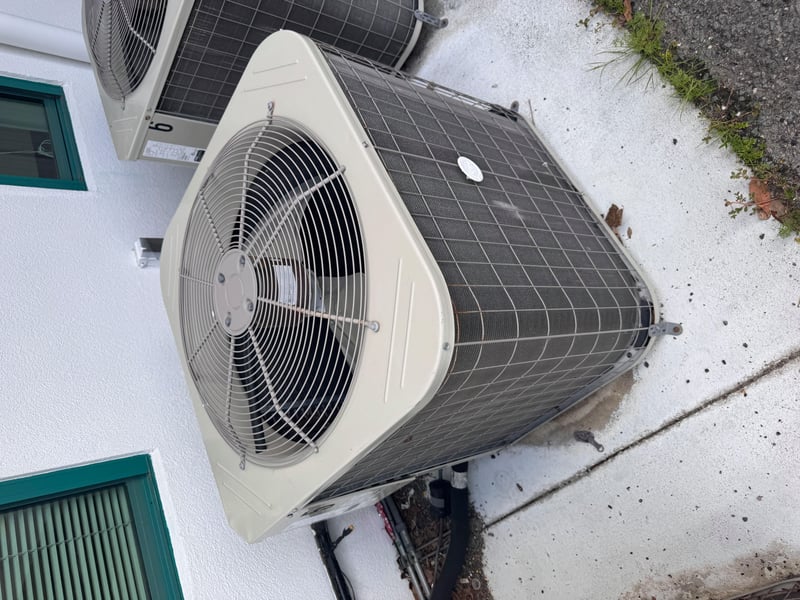 Condenser unit fan grille close-up at 11700 New Kings Rd, Jacksonville, FL 32219