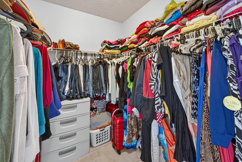 Walk-in closet with hanging clothes at 2875 Pebblewood Ln, Orange Park, FL 32065
