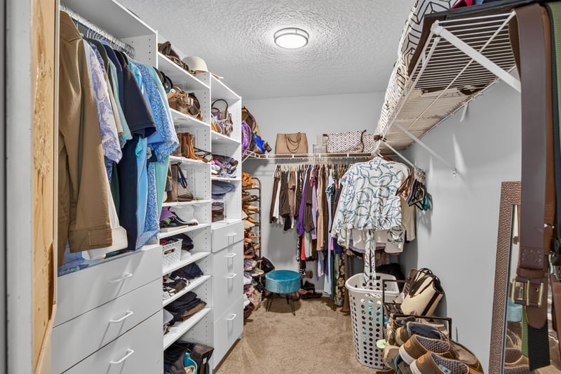 Walk-in closet with built-in shelving at 12825 Kelsey Island Dr, Jacksonville, FL 32224