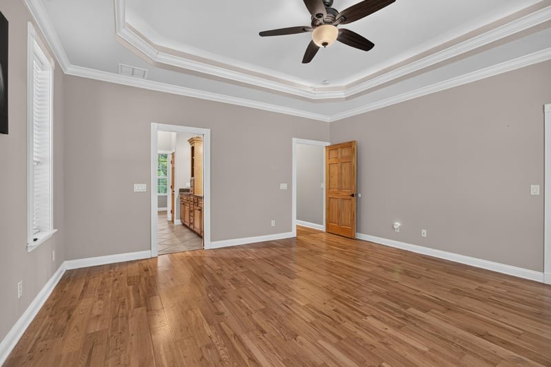 Primary suite sitting area with hardwood floors at 1735 Hagans Ridge Ct