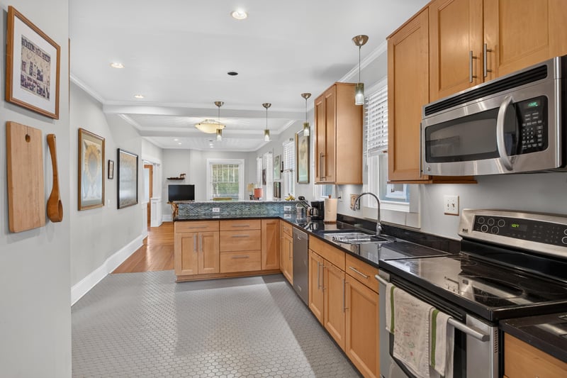 Kitchen with stainless appliances and pantry cabinet at 1555 Belmonte Ave, Jacksonville, FL 32207