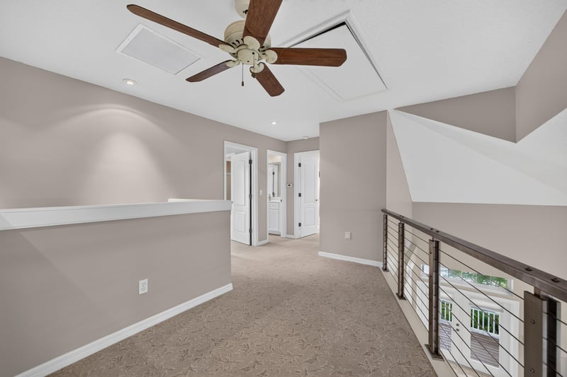 Empty room with tray ceiling at 117 Island Cottage Way, St. Augustine, FL 32080