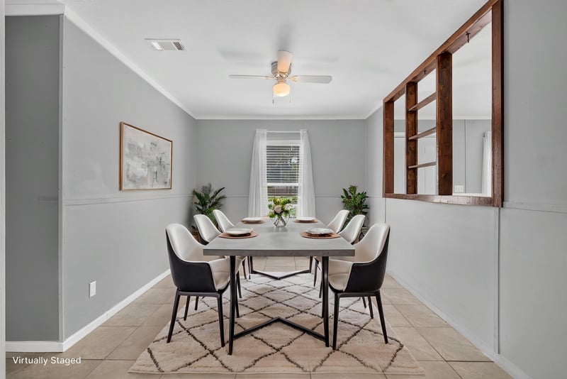 Dining area staged with table and chairs at 2549 Snapdragon Ave, Middleburg, FL 32068