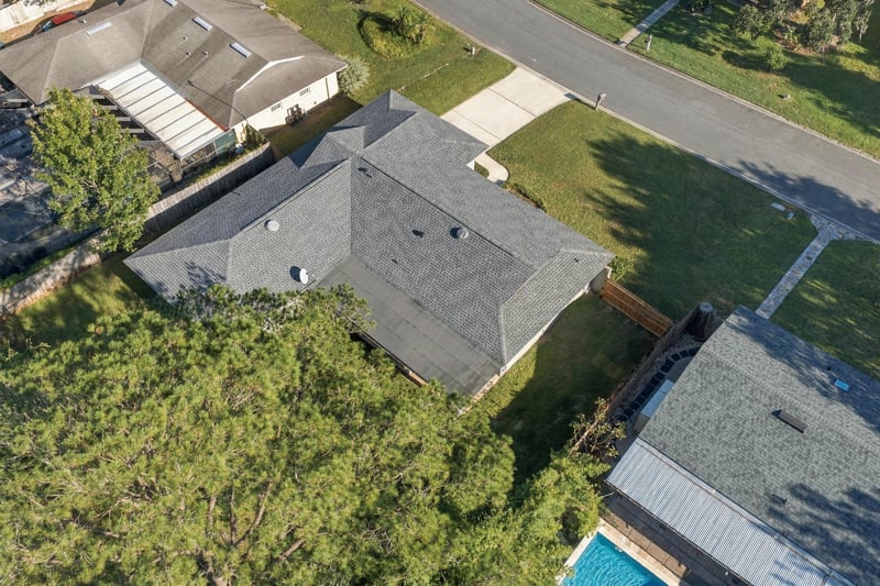 Drone aerial view of the home and surrounding trees, photographed by Megapixeler on Crosby Ln, Orange Park