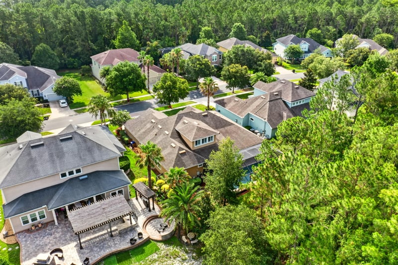 Aerial view of rooftops and backyard pools in Ponte Vedra Beach, FL
