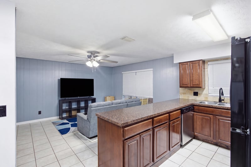 Kitchen island open to living room at 417 Capricorn Ln, Orange Park, FL 32073
