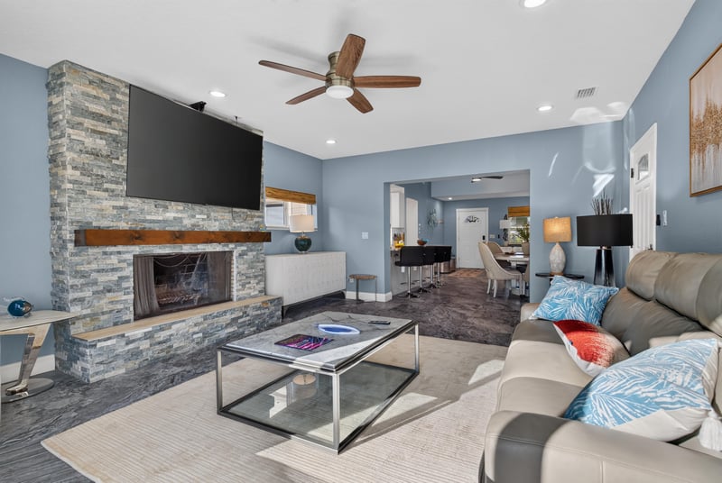 Living room with stone fireplace mantel at 1525 8th St N, Jacksonville Beach, FL