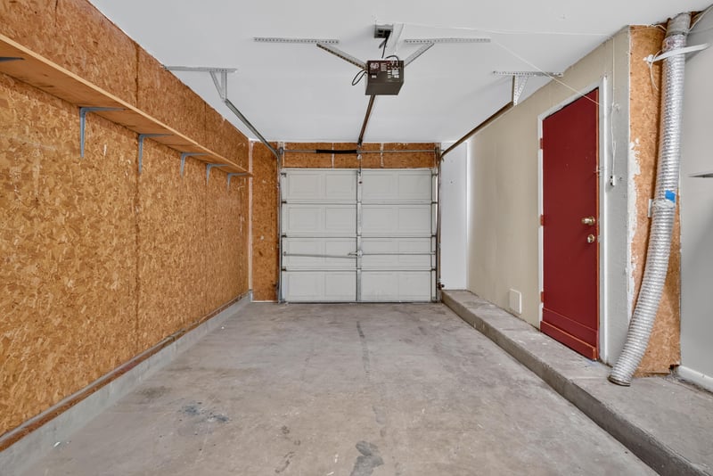 Garage interior with built-in storage at 8177 Virgo St, Jacksonville, FL 32216