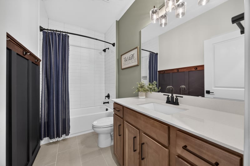 Bathroom with wood vanity and shower-tub combo at 2354 Jennings Farm Dr, Middleburg, FL 32068