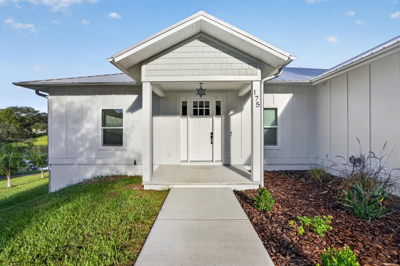 Front entry door and covered porch at 175 Alava Ct
