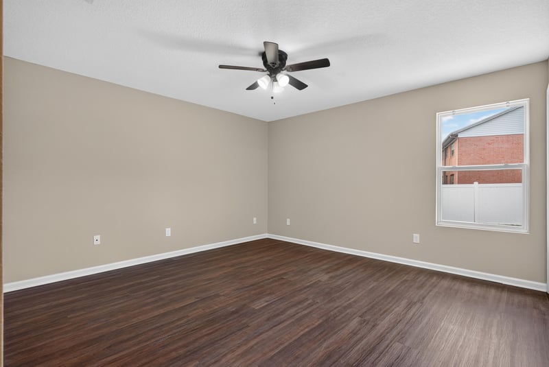 Bedroom, empty, ceiling fan and window at 7253 Townsend Village Ct, Jacksonville, FL