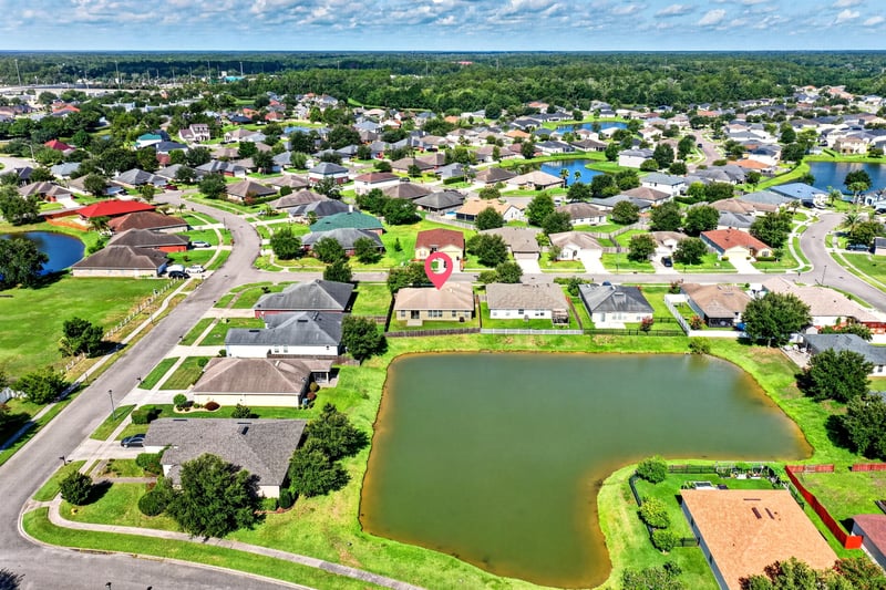 Aerial view of the street and pond at 7545 Lirope St, Jacksonville, FL 32244