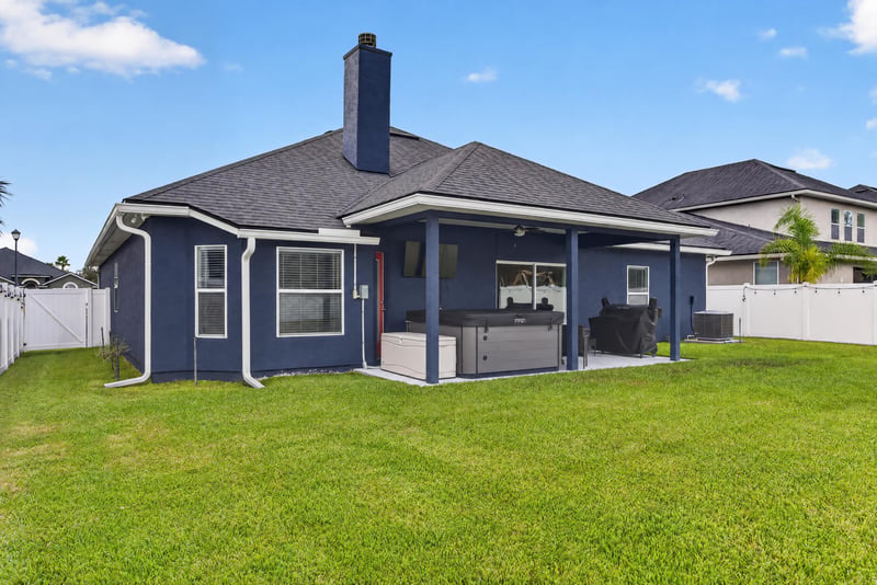 Backyard patio with chimney and seating area at 538 Porta Rosa Circle, St. Augustine, FL 32092