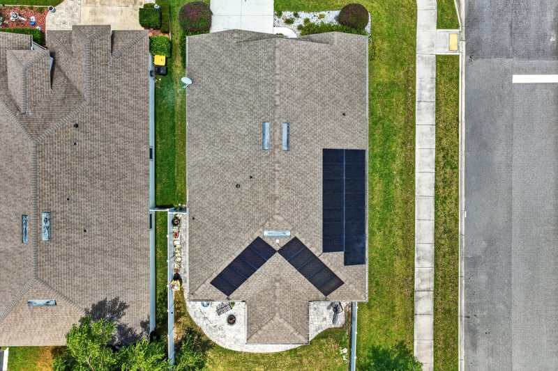 Aerial view of the roof and solar panel array at 10066 Andean Fox Dr, Jacksonville, FL 32222