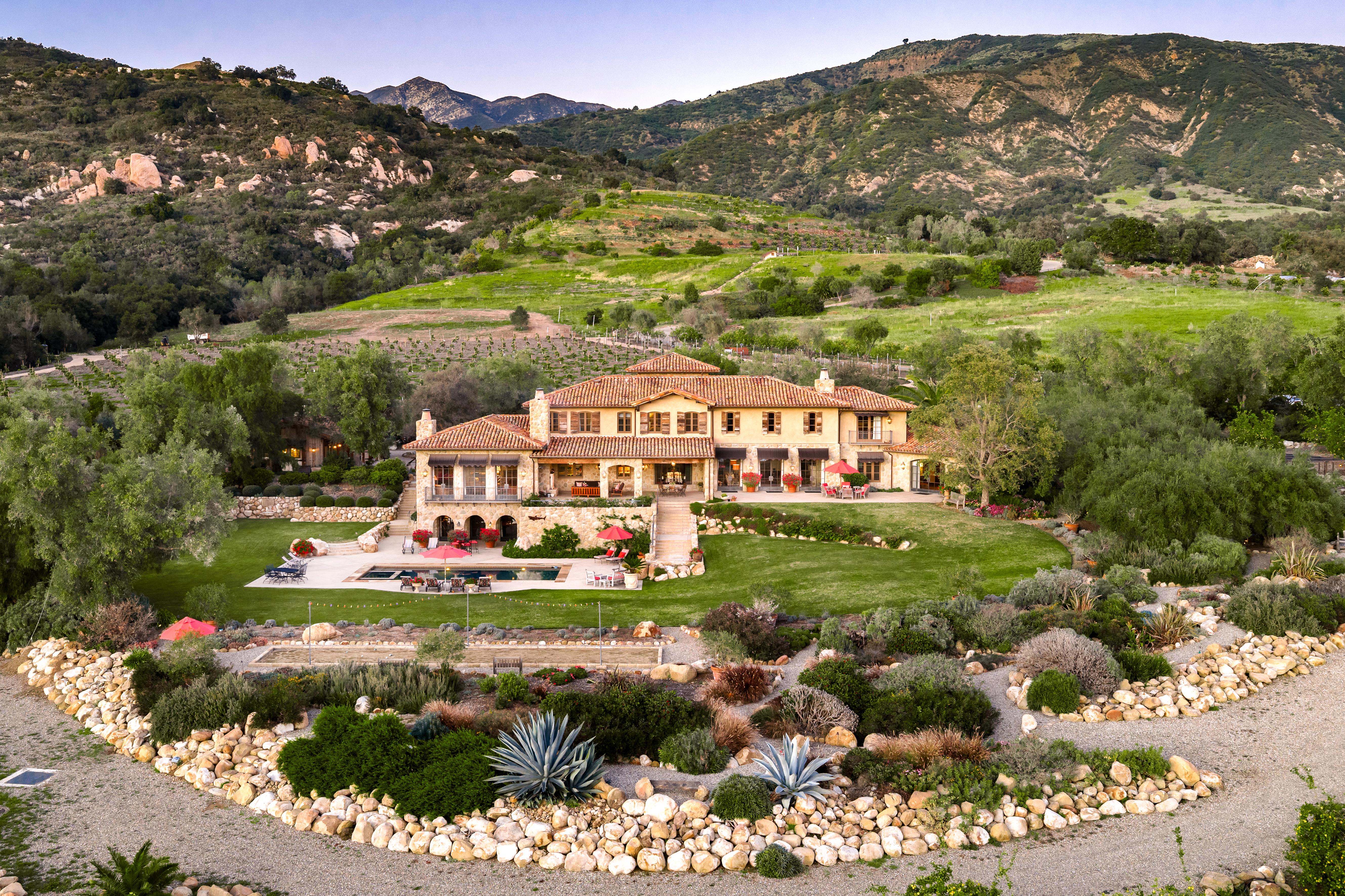 Sweeping aerial drone photography of luxury coastal estate at 1915 Monte Alegre Dr, Carpinteria — nearly 10,000 square feet of refined California living above the Pacific, captured by VirTour Media. Our team captured editorial photography, aerial drone photography via Inspire 3 Cinema Drone, a cinematic property video, a true vertical social media reel, and twilight photography from midday through twilight.