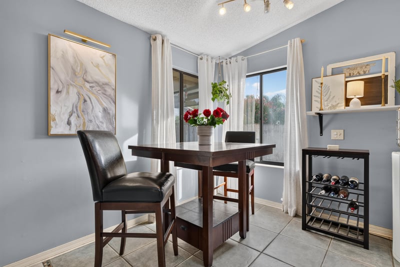 Dining nook with table and wine rack at 13020 Medford Ln, Jacksonville, FL 32225