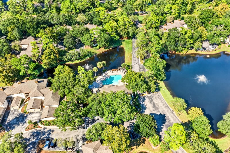 Aerial view of pond with fountain near the condo community in Jacksonville, FL