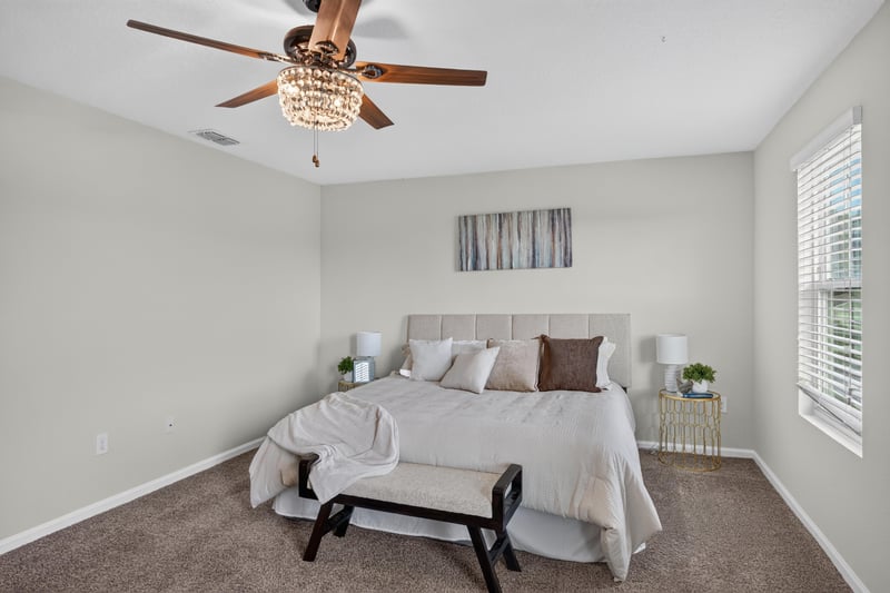 Primary bedroom with bench and windows at 6830 Hanford St, Jacksonville, FL 32219