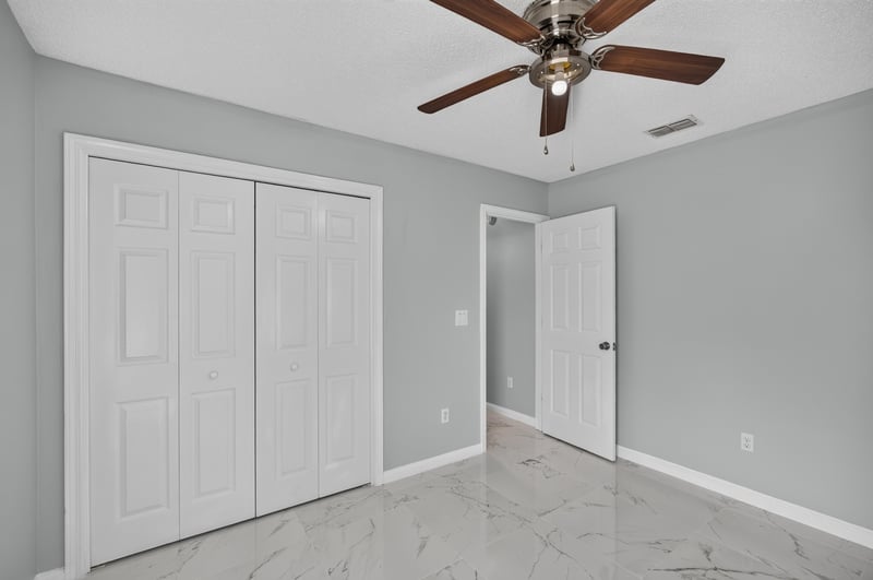 Hallway with double closet doors at 490 Hillside Dr, Orange Park, FL 32073