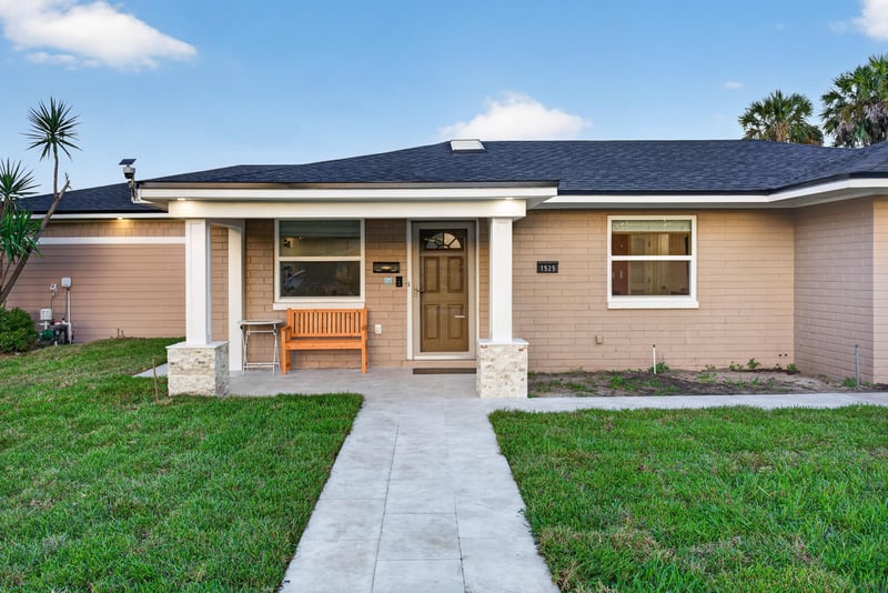 Front entry with covered porch and bench at 1525 8th St N, Jacksonville Beach, FL