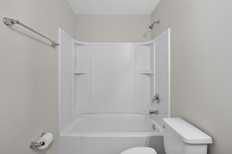 Primary bathroom tub and shower surround at 4024 Bay Hawk Ct, Jacksonville, FL