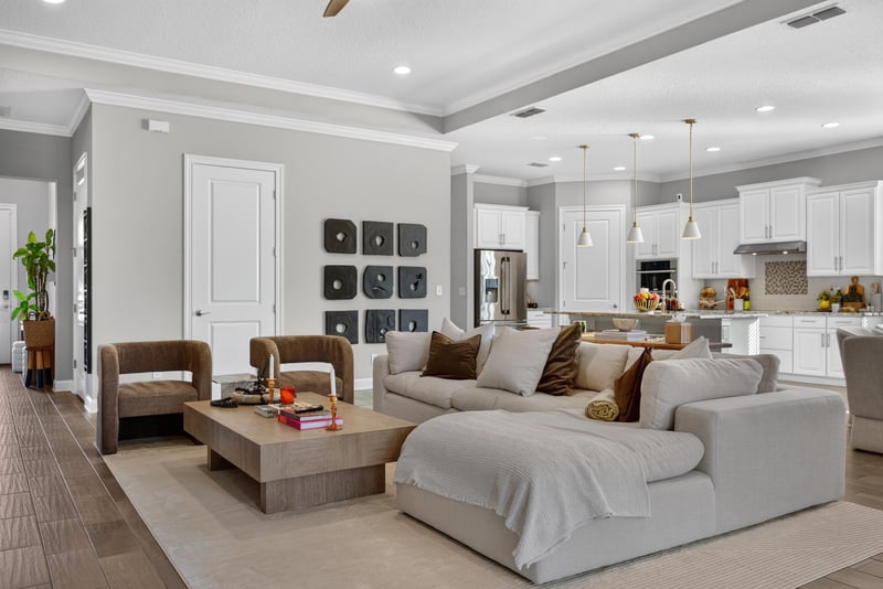 Living room seating area with tray ceiling at 3328 Southern Oaks Dr, Green Cove Springs, FL 32043