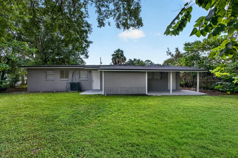 Covered back patio and open lawn at 6745 Jack Horner Ln, Jacksonville, FL 32210