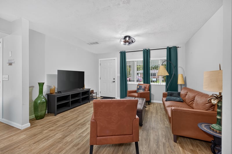 Living room view toward entry hall at 9506 Harriet Ave, Jacksonville, FL 32208
