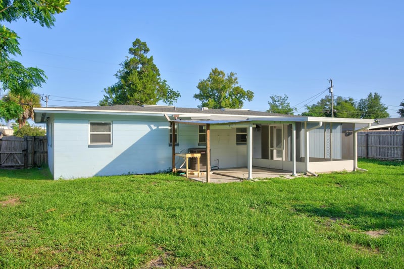 Back exterior with screened porch and yard at 442 Ameca Ave, Orange Park, FL 32073
