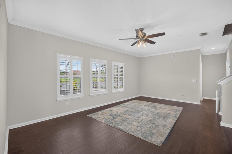 Dining room with wood floors and area rug at 1493 Greyfield Dr, St. Augustine, FL 32092