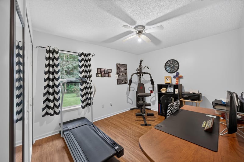Home gym with treadmill and exercise equipment at 13514 Las Brisas Way N, Jacksonville, FL