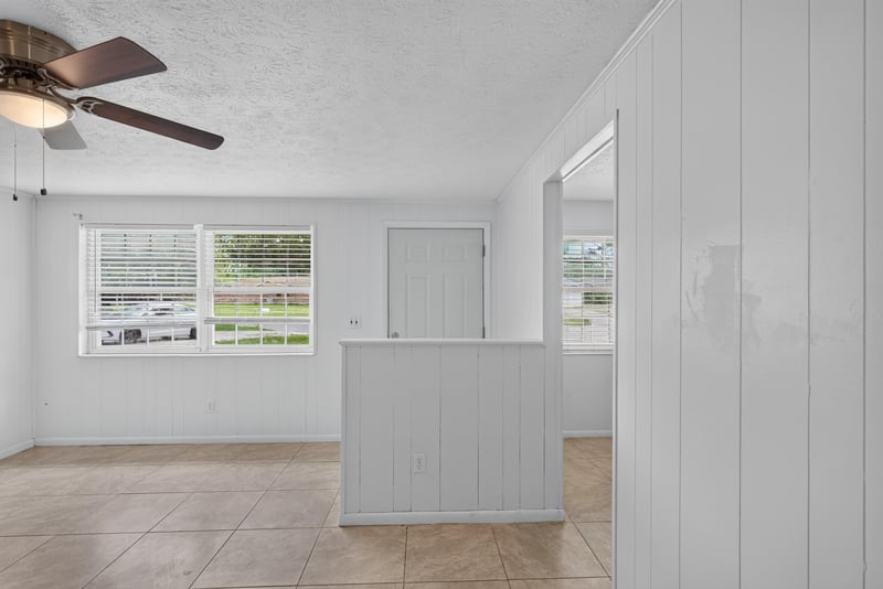 Empty room with ceiling fan and window at 9954 Larkdale Ct, Jacksonville, FL 32257