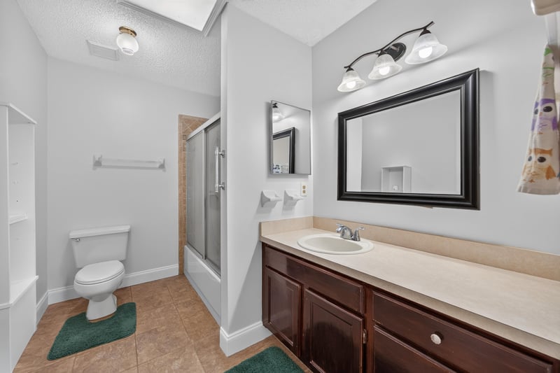 Bathroom with shower and toilet at 2435 Range Line Rd, Middleburg, FL