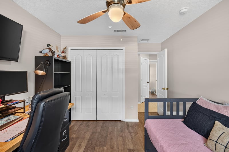 Bedroom set up as office with desk at 1589 Backwater Drive, Middleburg, FL 32068