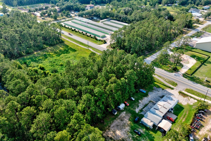 Aerial of storage buildings and mobile homes along the road at 4393 Co Rd 218, Middleburg, FL 32068