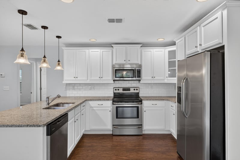 Kitchen view with pendant lights and stainless fridge at 1002 Ingleside Ave, Jacksonville, FL 32205
