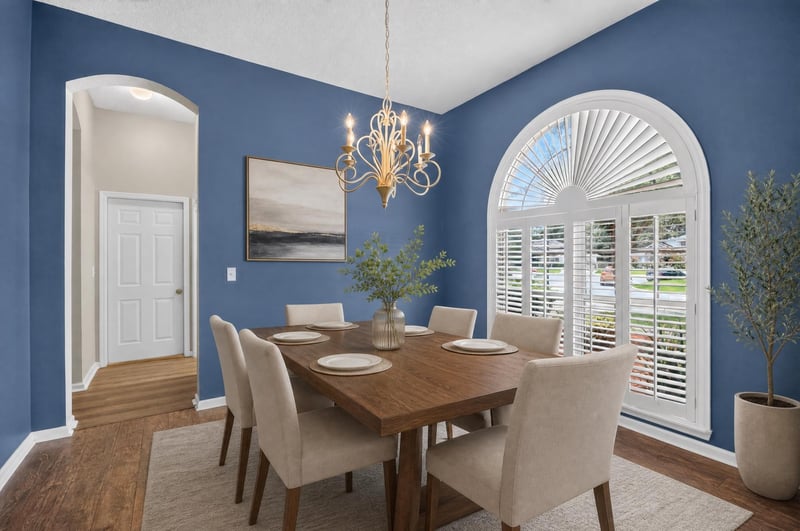 Dining room furnished with table and chandelier at 1955 GUARDED Way, Fleming Island, FL 32003