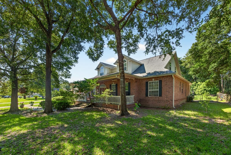 Brick front exterior with lawn and trees at 1735 Hagans Ridge Ct