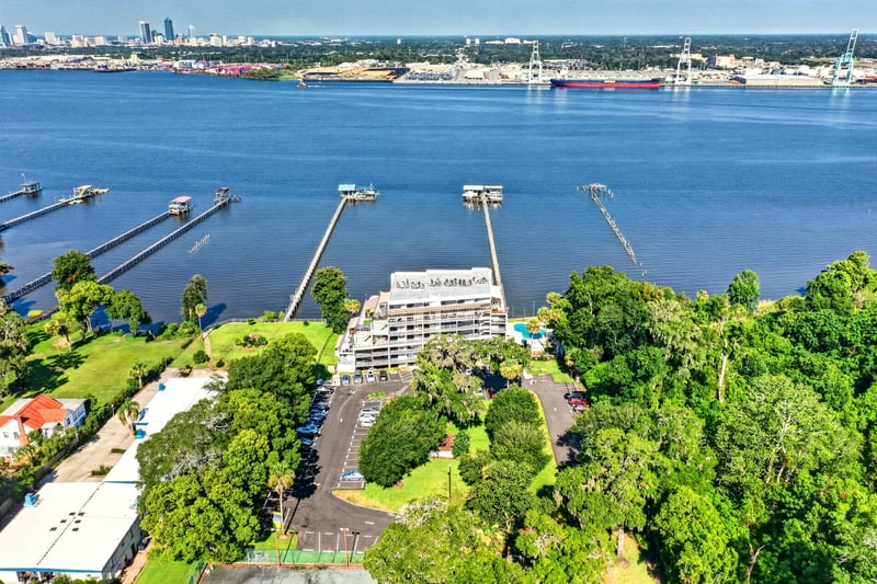 Aerial view of condo complex with pool in Jacksonville