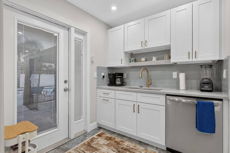 Kitchen area with glass door leading to patio at 1525 8th St N, Jacksonville Beach, FL