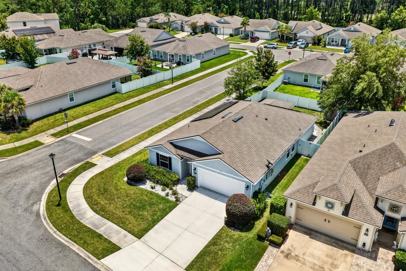 Aerial view of the curved street and surrounding homes in Jacksonville, FL