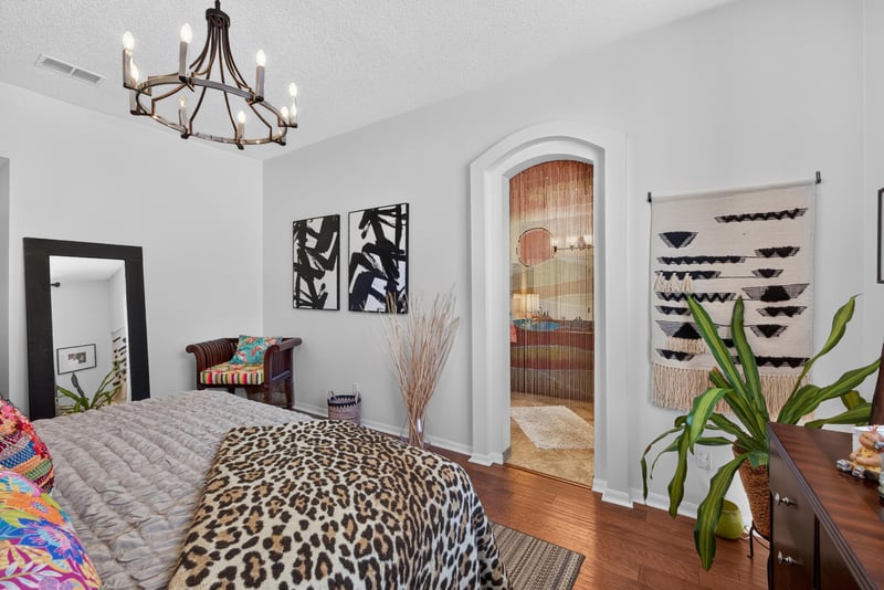 Bedroom corner with decorative wreath and window at 1820 Burgess Hill Dr E, Jacksonville, FL