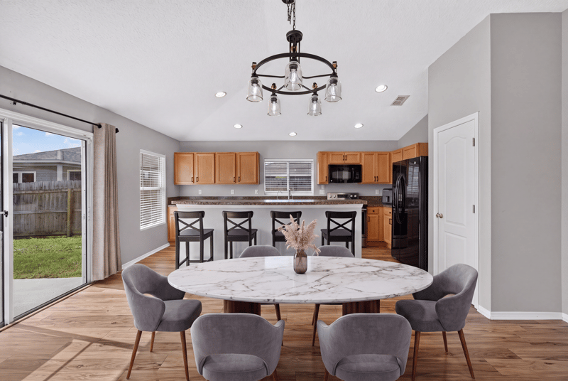 Dining area with round table near sliding door at 7545 Lirope St, Jacksonville, FL 32244