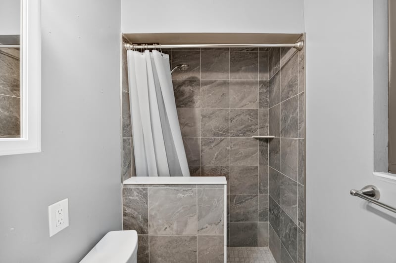 Bathroom with walk-in tiled shower at 1847 Grove Park Dr, Orange Park, FL