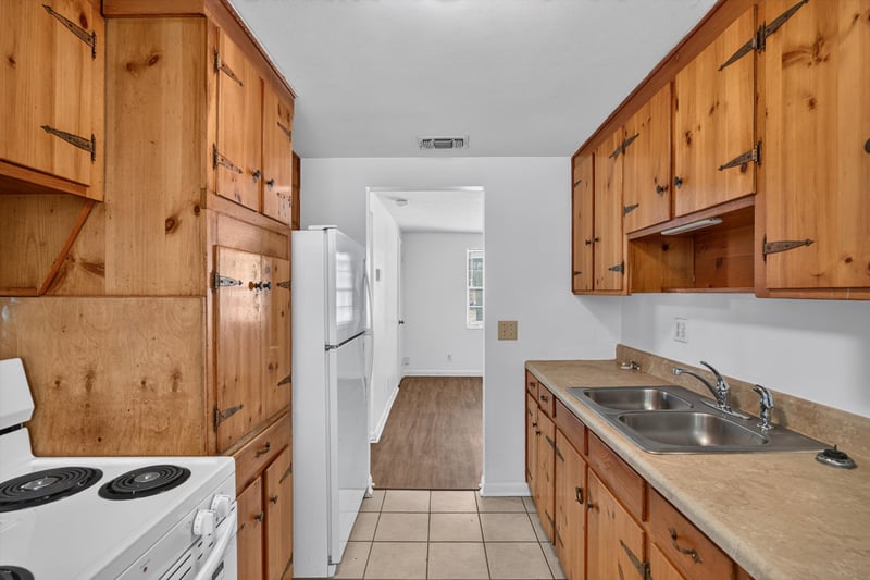 Kitchen with range, sink and hallway at 5812 Tampico Rd, Jacksonville, FL 32244