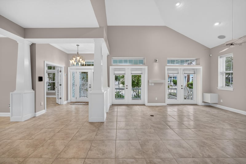 Living room with multiple french doors at 117 Island Cottage Way, St. Augustine, FL 32080