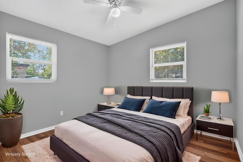 Bedroom with virtually staged bed at 1928 Montmarte Dr, Jacksonville, FL 32210