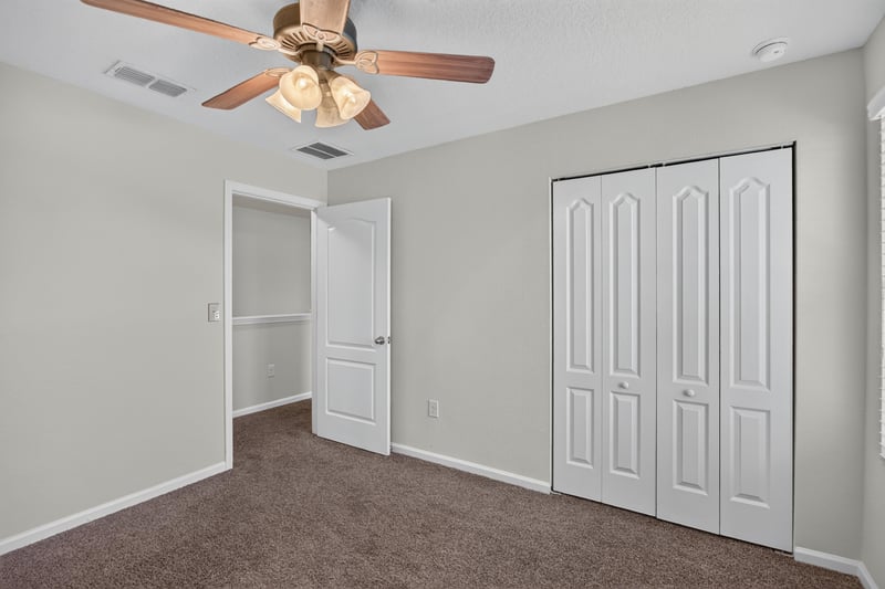 Room with closet doors and carpet at 6830 Hanford St, Jacksonville, FL 32219