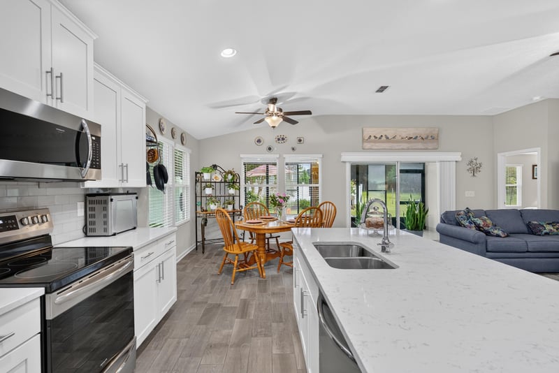 Kitchen and dining area open to living room at 4319 Green River Pl, Middleburg, FL 32068