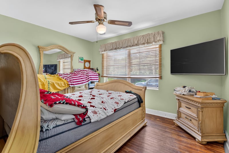Bedroom with television and ceiling fan at 5745 110th St, Jacksonville, FL 32244